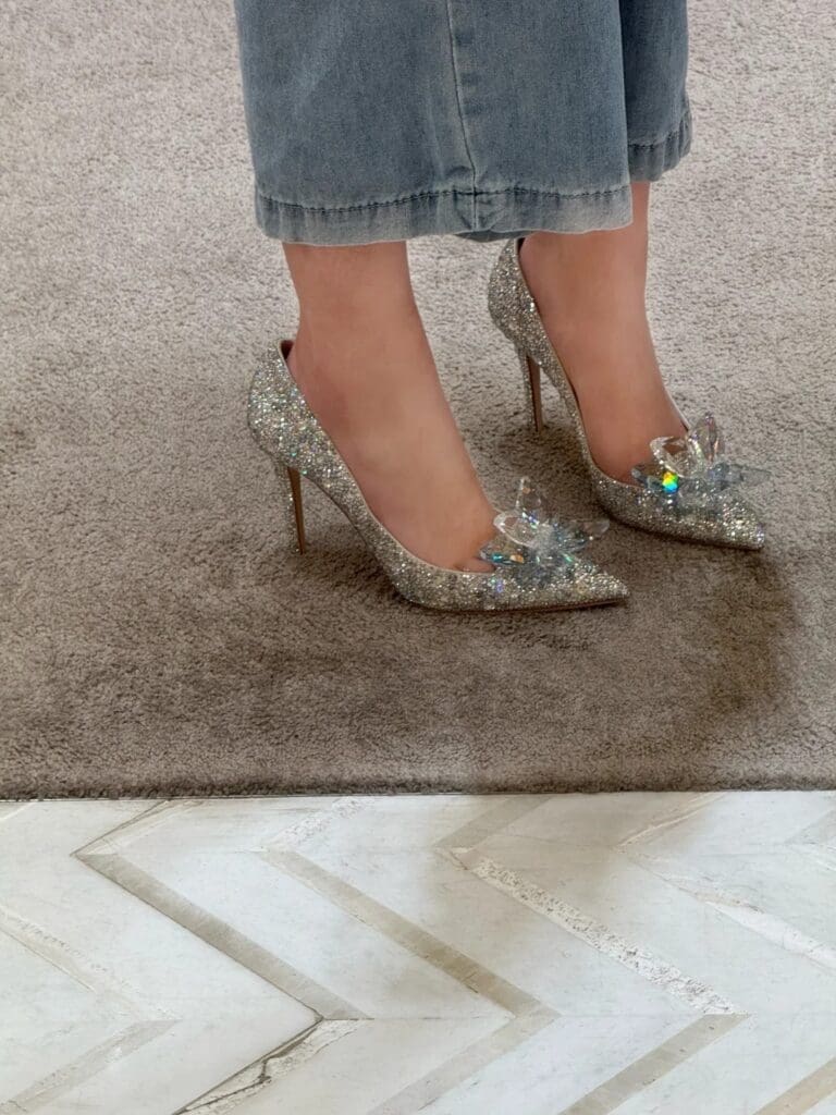 Feet wearing Jimmy Choo crystal high heel shoes collaboration with Love and Deepspace