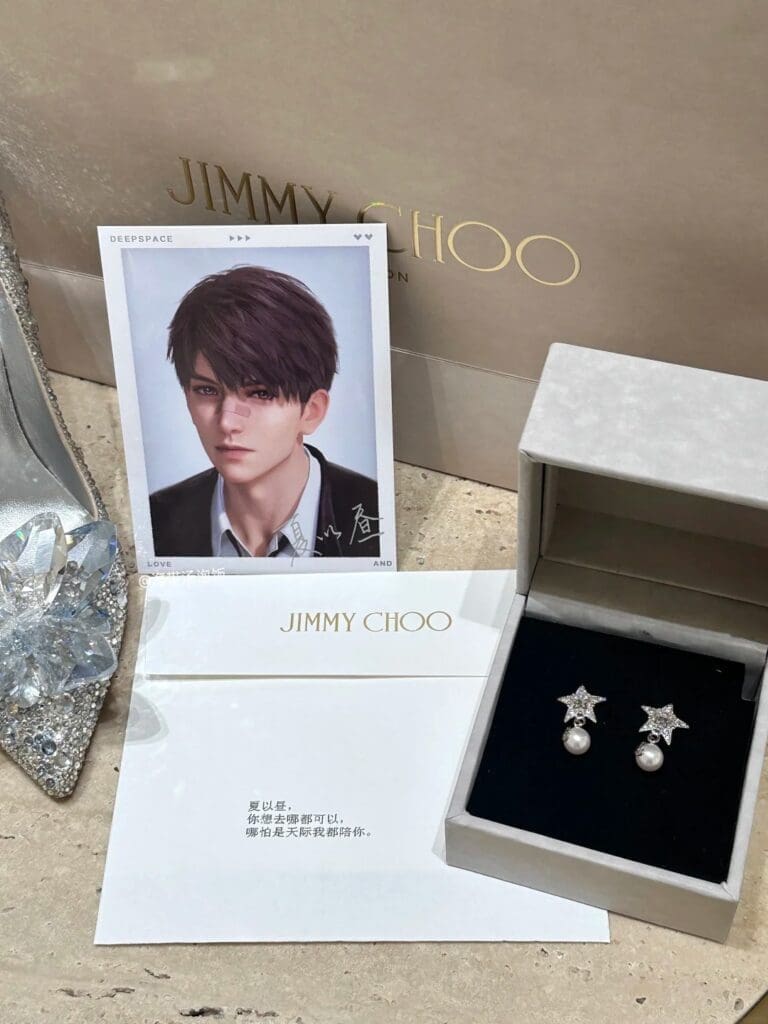 gift earrings from jimmy choo with a card showing a love and deepspace character, next to jimmy choo crystal shoe